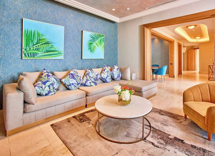 Suncoast Hotel & Towers in Durban: stylish lounge with sectional sofa, coffee table and open doorway
