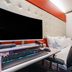 Hotel Atti Incheon guest room with gaming desk, large TV and tufted upholstered headboard