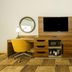 Hampton Inn Garden City room with desk, chair, TV, and bench seating
