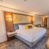 The Westfield Inn, BW Signature Collection in Westfield: guest room with king bed, kitchenette, and seating area