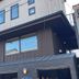 Guest House Wind Villa Kyoto exterior with dark facade and multiple windows