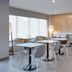 TownePlace Suites by Marriott Brunswick lobby seating area with tables, chairs, and large windows
