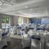 Hilton Garden Inn Tampa-East/Brandon in Tampa banquet room set with round tables and blue chair sashes
