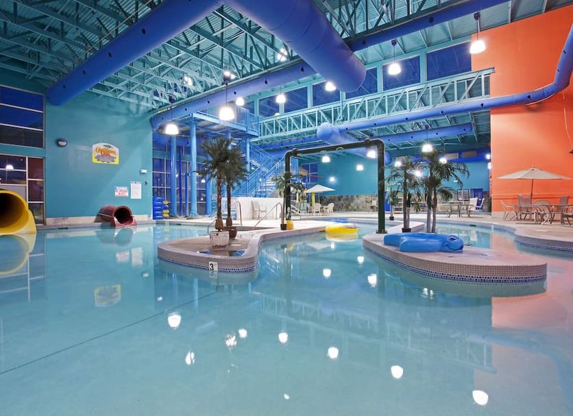 Garner Hotel Gillette South by IHG indoor pool with water slides and palm trees in Gillette