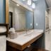 Extended Stay America Suites - Tampa - Casino Area bathroom with vanity, mirror and walk-in shower