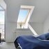 Hotel Nysted Havn, Nysted: guest room with balcony door, skylight, chair and water view