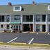 Jameson Inn Oakwood exterior with white balconies, green roof, and parking lot