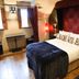 Glenskirlie Castle Hotel in Glasgow bedroom with burgundy canopy bed and LOVE pillows