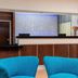 Fairfield Inn & Suites by Marriott Galesburg lobby with blue chairs and front desk