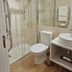 Casa De Casal De Loivos bathroom with glass shower, toilet, vessel sink and towel rack in Casal de Loivos