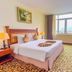 Sai Gon Rach Gia Hotel room in Rach Gia with king bed, desk, TV, and window view