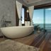 Boutique Hotel Marlin's in Tibau do Sul bathroom with freestanding tub and ocean-view window