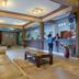 Kilimo Grand Resort Nairobi lobby with reception desk, seating area and floral decor