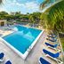 Vacation Village at Bonaventure, Weston, Fort Lauderdale pool with blue lounge chairs and palm trees