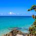 Sapphire Beach Club Resort in Simpson Bay with clear turquoise ocean and rocky shoreline