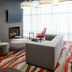 Residence Inn by Marriott Montreal Airport lounge with fireplace, seating area, and large windows in Montreal