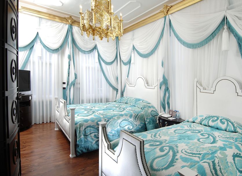 Premist Hotels Sultanahmet in Istanbul: ornate room with two twin beds, chandelier, and draped curtains