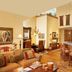 Faraway Jackson Hole in Teton Village: rustic suite with kitchen island, dining area, fireplace, and vaulted ceiling