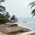The Yuppi Hippi Beachpackers Hostel in Anjuna with thatched huts and oceanfront beach view