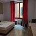 Hotel & Restaurant San Marco Ab room in Toscolano Maderno with bed, red curtains and window seating