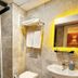 Naila Hotel Istanbul bathroom with glass shower, wall-mounted towels, and vanity mirror