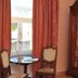La Maison De Maitre in Arbrefontaine: guest room with window, round table, chairs and armoire