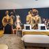 Hôtel Mercure Paris Place d'Italie guest room with mirrored wardrobe and fashion-themed wall mural