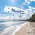 Zafiro Alzinar Mar in Can Picafort with a sandy beach and sparkling sea under a bright sky