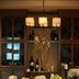 Renaissance Boulder Flatiron Hotel in Broomfield dining room with wine display, candles, and floral centerpiece