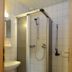 Hotel Kruse Zum Hollotal bathroom with glass shower, sink, toilet and tiled walls in Grapperhausen