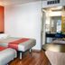 Motel 6 Mammoth Lakes guest room with two beds, wood floors, and a small table