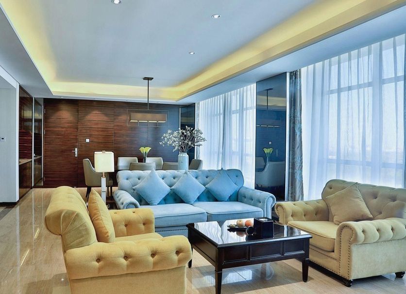 Parkyard Hotel Jiaxing lobby with tufted sofas, coffee table, wood wall and floor-to-ceiling windows in Jiaxing