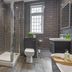 The Tudor House Hotel, Tewkesbury: modern bathroom with walk-in glass shower and tiled walls