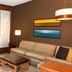 Hyatt Place Augusta guest room with sofa, desk, and bed near a window