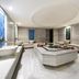 Mercure Istanbul Bomonti spa room with central treatment table and twin basins in Istanbul