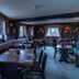 The Carpenters Arms Bristol pub-style dining room with wooden tables, benches, and large windows