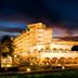 The Gateway Hotel Beach Road in Visakhapatnam at dusk with illuminated beachfront exterior and palm trees