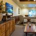 Cedar Creek Lodge And Conference Center in Columbia Falls lobby with seating area and glass entrance doors
