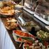 Hotel Ackermann in Riedstadt buffet table with pastries, fruit, sliced salmon and covered platters