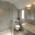 Hotel Noreg, Ålesund bathroom with walk-in shower, wall-hung toilet and double sink vanity