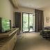 Hotel Chateau Gbelany room in Gbelany with king bed, balcony doors, and TV