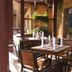 Przylądek Daglezja nad Jeziorem Kórnickim outdoor patio dining area with wooden tables and chairs in Kórnik