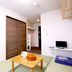 Lodge Koropokkuru Niseko room with tatami mats, low table, closet and small TV