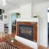 The Drifthaven at Gearhart in Seaside: cozy suite living room with fireplace, staircase and sofa