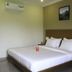 OYO 9618 Home 2 Bhk Vasco South Goa bedroom with double bed, AC, and bedside tables in Mandrem