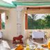 Vijayshree Resort, Hampi in Hosapete with a covered outdoor dining area and garden view