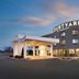 Courtyard by Marriott Johnson City exterior at dusk with covered entrance and illuminated facade