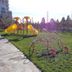 Rayentray Grand Hotel in Puerto Madryn, outdoor playground with slides and swings on a sunny lawn