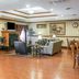 Quality Inn and Suites Ann Arbor Hwy 23 lounge with fireplace, seating area and dining tables