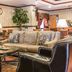 Quality Inn and Suites Ann Arbor Hwy 23 lobby with leather seating and round coffee table in Ann Arbor